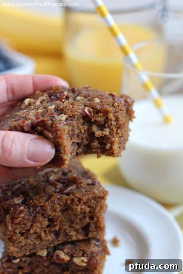 Whole Oatmeal Coffee Cake in Pan A whole Oatmeal Coffee Cake freshly baked in an 8x8 pan, ready to be sliced for a family breakfast.