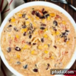 Ultimate Easy Crock Pot Cream Cheese Chicken Chili 4 Fantastic and easy Crock Pot Cream Cheese Chicken Chili recipe in a white bowl.