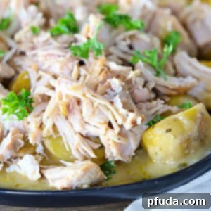 Golden potatoes topped with tender pork chops and parsley.