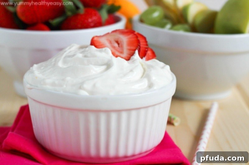 Close up of fruit dip with an apple slice ready for dipping