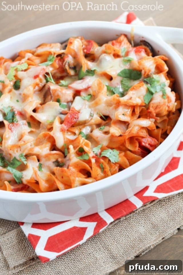 A delicious casserole with chicken, mushrooms, tomatoes and egg noodles tossed in a flavorful sauce made using enchilada sauce and OPA Greek Yogurt Ranch Dressing. Best casserole EVER! A delicious casserole with chicken, mushrooms, tomatoes and egg noodles tossed in a flavorful sauce made using enchilada sauce and OPA Greek Yogurt Ranch Dressing. Best casserole EVER!