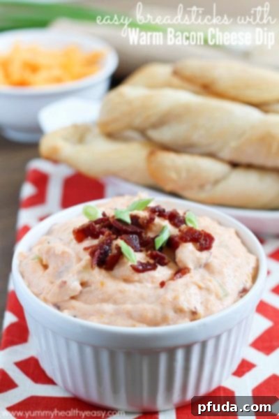 Delicious and super EASY breadsticks (made with Pillsbury Grands! Biscuits) and a warm bacon cheese dip to dunk them in!! Delicious and incredibly easy breadsticks, made with Pillsbury Grands! Biscuits, served with a warm, savory bacon cheese dip for dipping. A perfect appetizer!