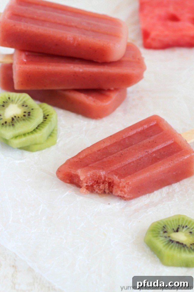 Beautifully layered Watermelon Kiwi Popsicles ready to be served