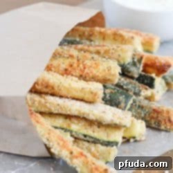 Baked Zucchini Fries with yummy ranch dipping sauce - fun and easy side dish that's healthy and delicious!