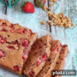 Strawberry Walnut Bread - a delicious quick bread filled with fresh strawberries and walnuts. Easy, light and flavorful! yummyhealthyeasy.com