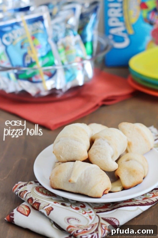 Homemade pizza rolls with pepperoni and cheese, served with a refreshing Capri Sun juice pouch. Perfect for a quick and easy summer meal or snack.