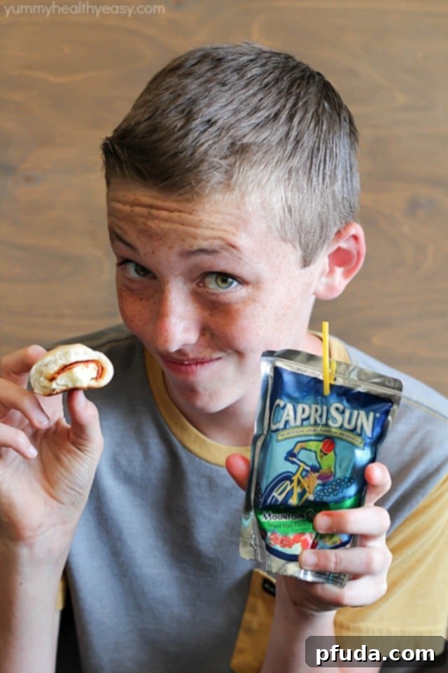 Smiling children enjoying their Capri Sun drinks, illustrating the universal appeal and refreshment these pouches provide during playful summer days.