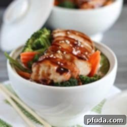 Delicious Chicken Teriyaki Bowls with chicken baked in a homemade teriyaki sauce layered on top of a bed of rice & veggies!