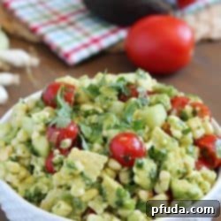 Delicious grilled corn mixed together with avocado, tomato, feta, green onions, cilantro and cucumber then tossed in an easy dressing. The perfect refreshing side dish for a BBQ!