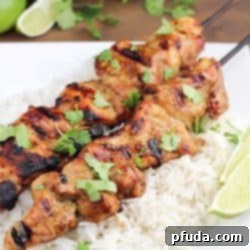 Marinated and grilled Thai Coconut Chicken Skewers over a bed of delicious coconut rice!