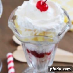 Tropical Trifle - layers of angel food cake, strawberries, pineapple, coconut, cream of coconut & topped with whipped cream! So tasty!