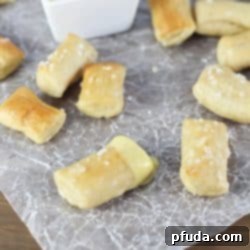 Pretzel Bites dunked in an EASY honey mustard dipping sauce...perfect for noshing after school or while watching a football game!