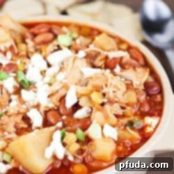 Crock Pot Chicken Pinto Bean Chili 2 Yummy crock pot chicken chili stew with pinto beans, potatoes, corn, spices and topped with feta cheese. Easy prep and so delicious!