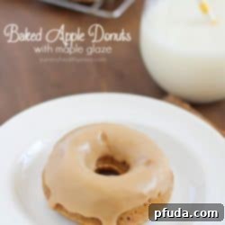 These Baked Apple Donuts with Maple Glaze are seriously the best baked donuts ever! Moist, apple-spiced flavor dipped in the tastiest maple glaze known to man. And only 196 calories per donut!