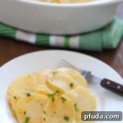 Effortlessly Delicious Homemade Cheesy Potato Gratin 2 Homemade Cheesy Potatoes Au Gratin, a perfect Thanksgiving side dish.