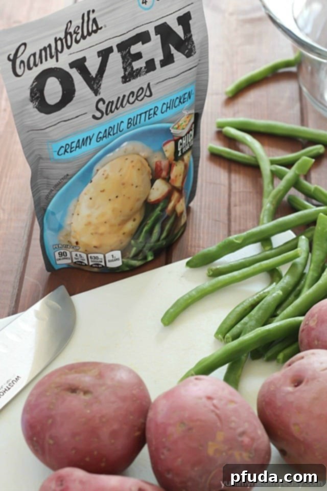 Garlic Butter Chicken with Green Beans and Potatoes One-Pot Dinner 3 Close-up of the delicious one-pot meal in a baking dish, highlighting the succulent chicken, tender potatoes, and crisp green beans.