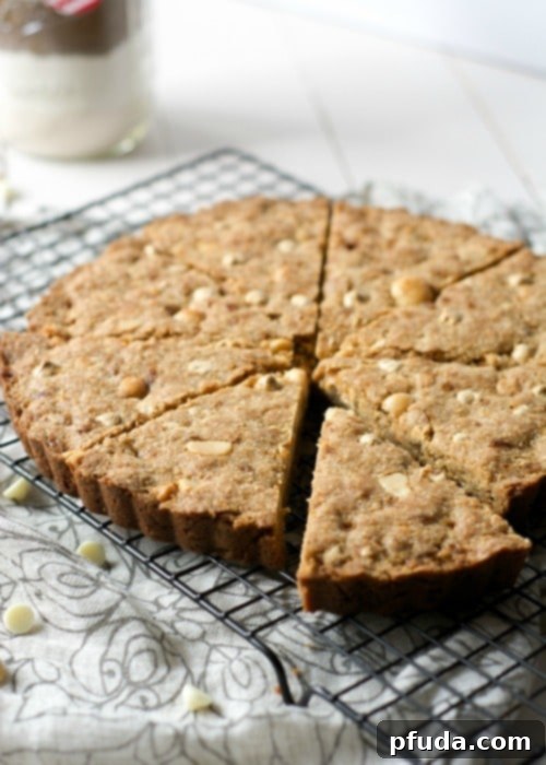 Whole Wheat White Chocolate Macadamia Cookie Cake from The Housewife in Training Files: Fiber-rich whole wheat flour with decadent white chocolate and macadamia nuts.