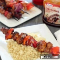 Sticky Teriyaki BBQ Pork Skewers 2 Delicious grilled shish kabobs with tender pork, mushrooms, red peppers, tomatoes and onions. The perfect game day or ANY day meal! #evergriller #ad