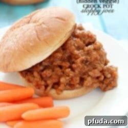 Delicious Hidden Veggie Crock Pot Sloppy Joes with a rich, savory sauce.
