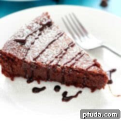 Flourless Chocolate Cake is made with a secret ingredient instead of flour... ;) The most incredible moist, fudgy, decadent cake that's incredibly light and crumbly all at the same time! Perfect Valentine's Day dessert! #truvia