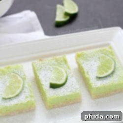 Classic lime bars with a golden crust and bright green, fluffy citrus filling.