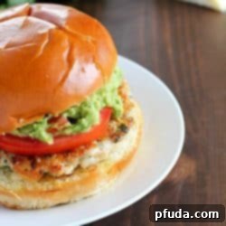 Avocado Lime Chicken Burgers 2 The juiciest, most delicious, guacamole chicken burgers! Super simple to make - serve on buns with a layer of guacamole on the top. Amazing!