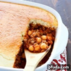 This Healthier Sloppy Joe Casserole is a healthy recipe filled with pureed vegetables, lean ground turkey, and chickpeas, topped with a yummy biscuit topping.