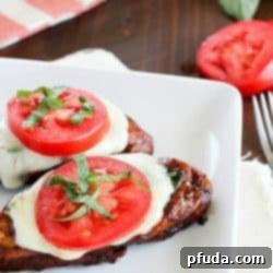 Easy Balsamic Chicken recipe with a caprese twist! Chicken breasts are cooked until tender in a flavorful balsamic sauce then topped with mozzarella, basil & tomato. Low carb and gluten free!
