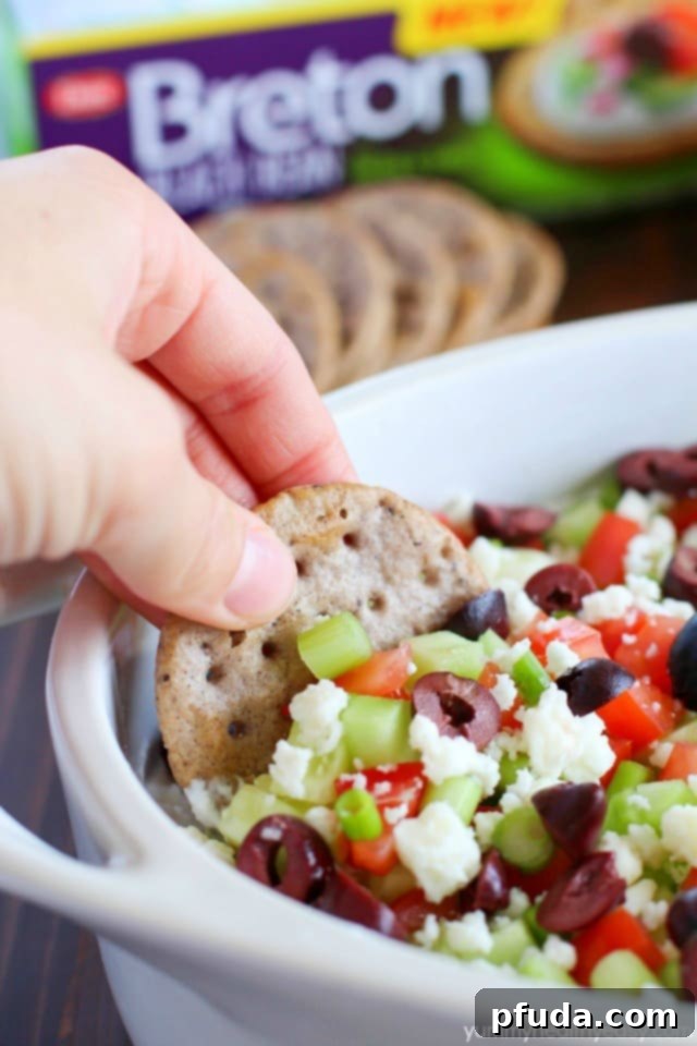 Wholesome Gluten-Free Greek Delight 4 Deliciously healthy greek dip, made with a protein-rich cottage cheese base (with ranch seasonings!) then topped with cucumbers, green onions, tomatoes, kalamata olives, and feta cheese. Healthy and full of flavor! #breton #ad