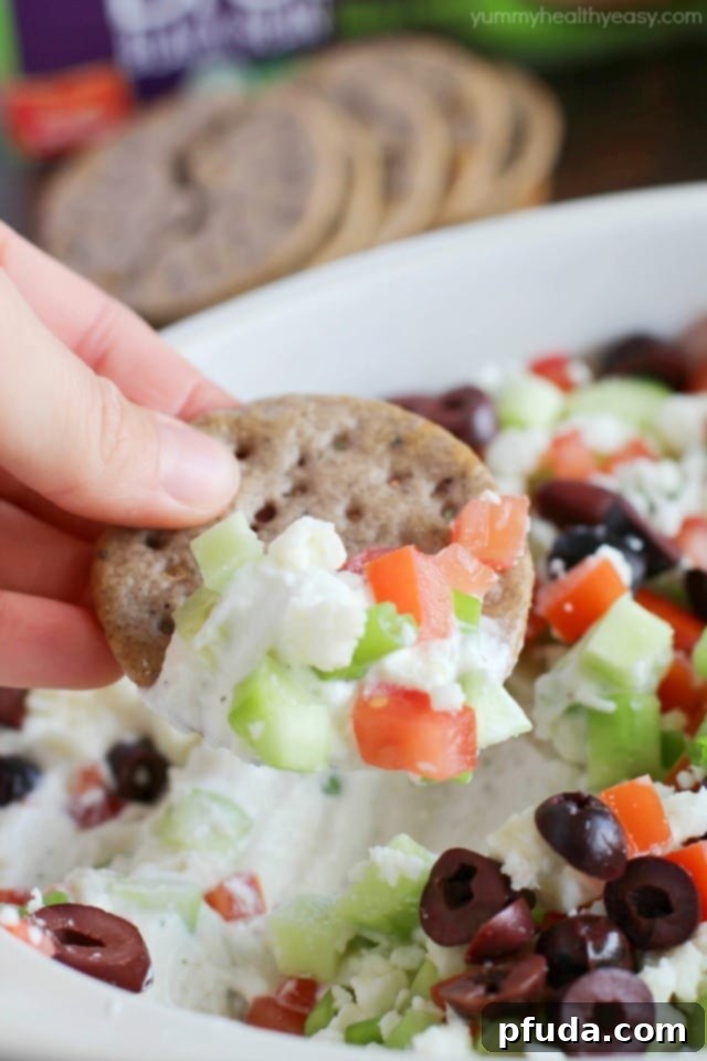 Wholesome Gluten-Free Greek Delight 6 Deliciously healthy greek dip, made with a protein-rich cottage cheese base (with ranch seasonings!) then topped with cucumbers, green onions, tomatoes, kalamata olives, and feta cheese. Healthy and full of flavor! #breton #ad