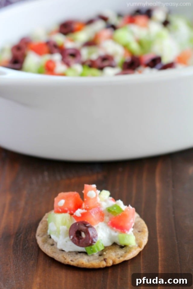 Wholesome Gluten-Free Greek Delight 7 Deliciously healthy greek dip, made with a protein-rich cottage cheese base (with ranch seasonings!) then topped with cucumbers, green onions, tomatoes, kalamata olives, and feta cheese. Healthy and full of flavor! #breton #ad