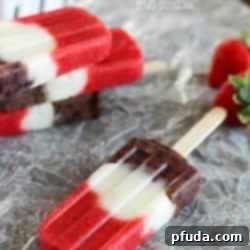 Red, White & Blueberry Healthy Fruit Popsicles - a healthy and easy treat the entire family will gobble up! Perfect to make for Memorial Day or 4th of July... or really anytime. :)