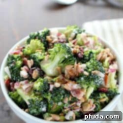 Luscious Creamy Broccoli Salad 2 Need an easy side dish? Make this Creamy Broccoli Salad! It's full of fresh broccoli, red onion, dried cranberries, sunflower seeds and bacon mixed in a creamy, delicious dressing. Always a hit!