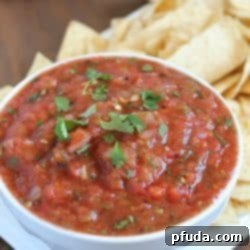 A bowl of delicious, chunky homemade roasted salsa.