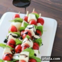Easy Caprese Bites with Balsamic Glaze 2 Summer afternoons call for these fun Caprese Skewers! Cherry tomatoes, fresh basil and cubes of mozzarella cheese threaded on skewers and drizzled with an easy balsamic reduction. Delicious!