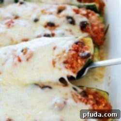 Satisfying Black Bean and Quinoa Zucchini Boats 2 Healthy Black Bean & Quinoa Stuffed Zucchini - a hearty and easy meatless side dish or dinner that's gluten-free and clean-eating. So delicious, you won't even think it's healthy!
