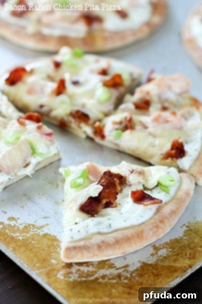 Bacon Ranch Chicken Pita Pizza is topped with ranch dip, chicken, bacon and cheese for a quick and easy lunch, dinner or snack.