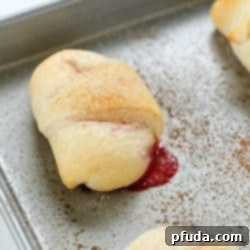 A delicious Strawberry Cheesecake Roll dessert with a creamy, fruity filling.