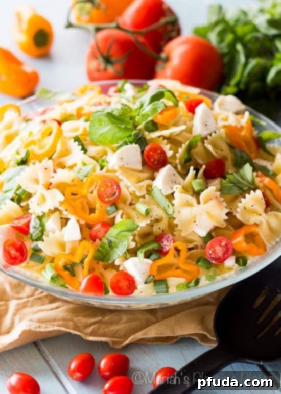 Caprese Pasta Salad with Roasted Garlic Vinaigrette - a fresh and flavorful side.