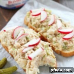 Take that boring tuna sandwich to the next level and make this Mediterranean Hummus Tuna Sandwich Recipe! It's easy, healthy and super flavorful! Definitely a lunchtime winner!