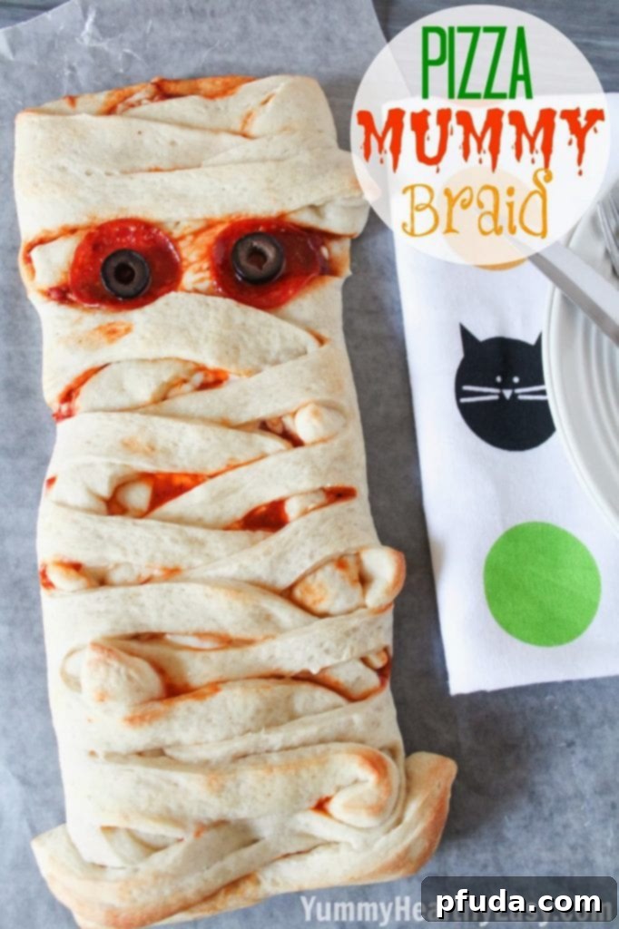 20+ Hauntingly Delicious Halloween Treats 2 Pizza Mummy Braid, a savory Halloween meal