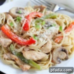 Cajun Chicken Pasta with mushrooms, bell peppers and chicken in a creamy sauce over pasta noodles. Flavorful, creamy and totally comforting. Perfect fall dinner! #FosterFarmsFresh AD