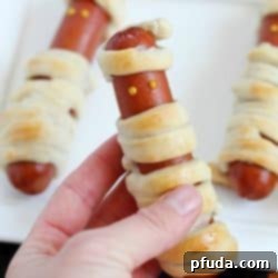 Looking for a fun, kid-friendly dinner for Halloween? Make these Hot Dog Mummies aka Mummy Dogs! A super cute and really easy recipe with only two main ingredients!