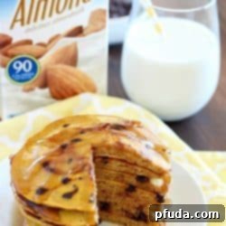 Small stack of fluffy pumpkin chocolate chip pancakes