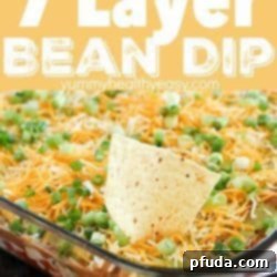 You will love this 7 Layer Bean Dip! This is my Mom's quick & easy recipe for the most requested, most popular appetizer in our family. It's perfect to bring to a party or to serve during game day!