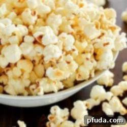 Homemade Kettle Corn that tastes like you bought it at the state fair AND it's totally easy to make! Only a few ingredients and a few minutes and you're enjoying kettle corn right at home!