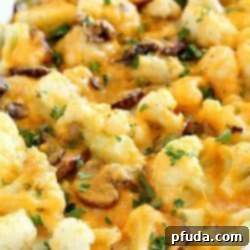 Cheesy Cauliflower Casserole with golden-brown crust, a perfect healthy and flavorful dish for any occasion.