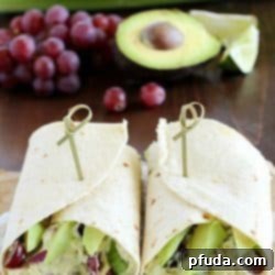 Avocado Chicken Salad Wrap - a perfect blend of avocado, Greek yogurt, chicken, celery, grapes, red onion & spices to make your lunch complete! This is healthy and only takes a few minutes to whip up!
